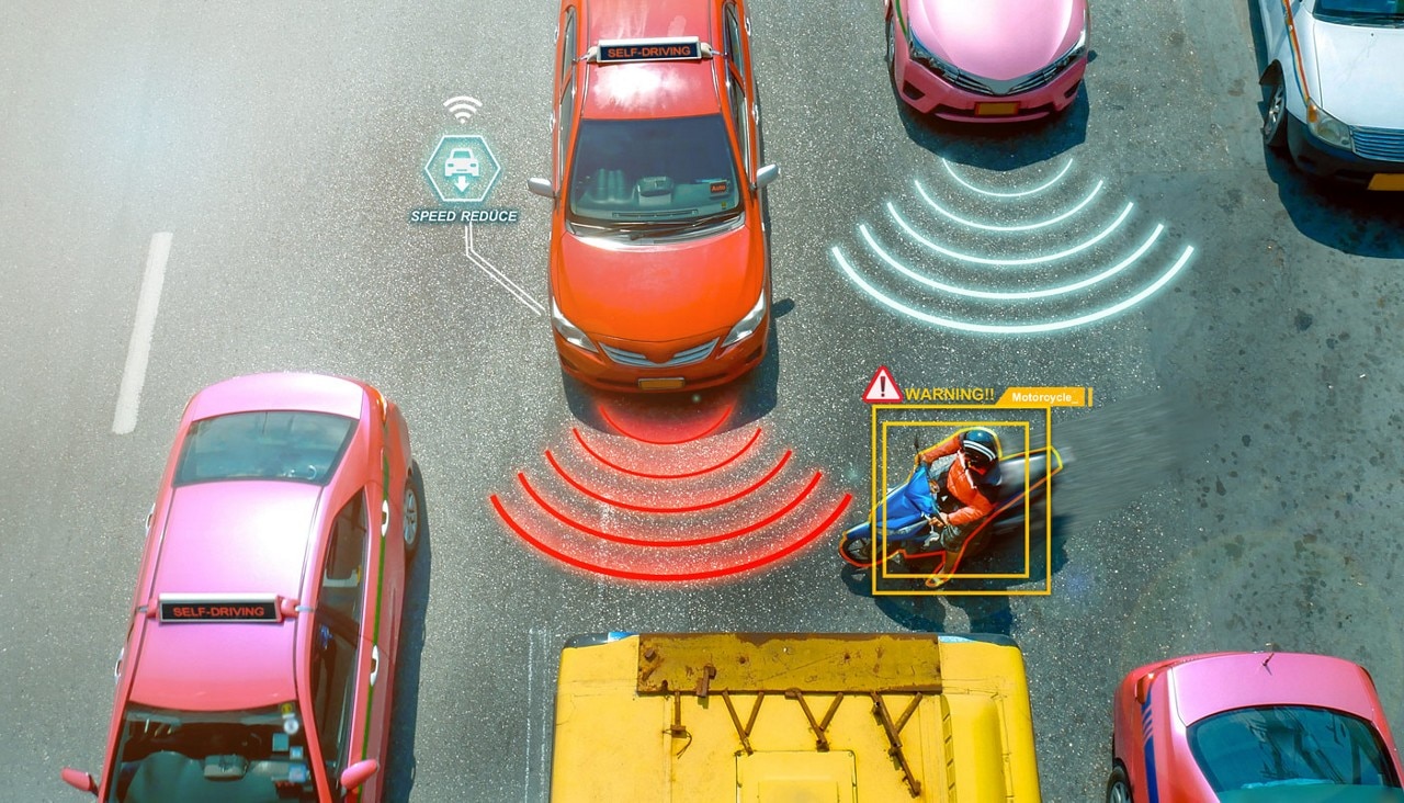 Graphic of several cars driving on a road with various cars via illustrations showing the technology that is keeping the drivers safe.