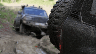 Vehicle being towed by another vehicle.